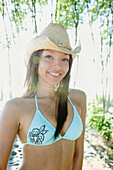 African woman in bikini wearing cowboy hat, Seattle, WA