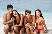 South American friends laughing at beach, Morrocoy, Venezuela