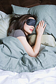 Woman sleeping with eye mask, San Rafael, CA