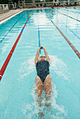 Hispanic woman swimming in swimming pool, Caracas, Caracas, Venezuela