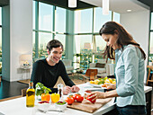 Couple making dinner together in kitchen, Los Angeles, California, USA