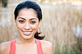 Smiling Indian woman outdoors, Los Angeles, California, USA