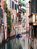 Boat moored in ornate canal, Venice, Venezia, Italy