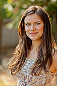 Smiling Caucasian woman standing outdoors, Seattle, WA, USA