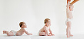 Babies laying, sitting and standing together, Jersey City, New Jersey, USA