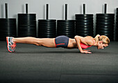 Caucasian woman doing push-ups, Laguna Niguel, California, USA