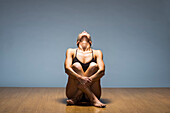 Caucasian woman practicing yoga in studio, San Fransisco, California, United States