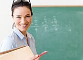 Caucasian teacher smiling in classroom, Jersey City, New Jersey, USA