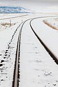 Snow-Covered Railroad Tracks in Rural Landscape, Ely, Nevada, USA