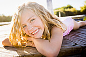 Caucasian girl smiling on dock, American Fork, Utah, USA