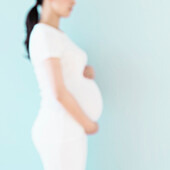 Defocused profile of pregnant Japanese woman, Jersey City, NJ, USA