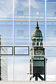 Reflection of St. Michael's Church in a glass facade, Hamburg, Germany