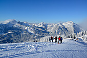 Back-country skiers ascending to mount Rosskopf, Bavarian Prealps, Upper Bavaria, Germany