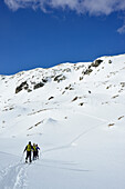 Back-country skiers ascending to Schafsiedel, Kitzbuehel Alps, Tyrol, Austria