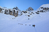 Back-country skiers ascending to Cristallo wind gap, Cristallo, Dolomites, Belluno, Veneto, Italy