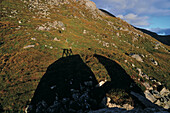 Silhouette of three persons at a hill, Loch Crabhadail, Harris, Lewis and Harris, Outer Hebrides, Scotland, Great Britain