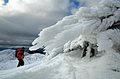 Hiker ascending in snow, Beinn Dearg, Highlands, Scotland, Great Britain