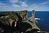 Hikers on cliff coast, Old Man of Hoy, Hoy, Orkney Islands, Scotland, Great Britain
