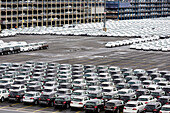 New cars from different manufacturers on a parking area awaiting shipping in Bremerhaven, Germany
