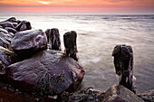 Groynes and stones covered with ice in the morning light, icicles, Strande, Kiel Fjord, Schleswig-Holstein, Germany