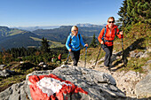 Women hiking along a ridge, Duerrnbachhorn, Reit im Winkl, Chiemgau, Bavaria, Germany
