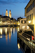 River Limmat and Grossmunster at dusk, Zurich, Switzerland