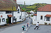 Berrynarbor village with children playing, Devon, England, Great Britain