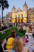 'Europe, Principality of Monaco, festival celebrating the 150th anniversary of the SBM (Societe des Bains de Mer), Princely picnic ''lunch on grass'' hold on the Casino Square and organized by chef Alain Ducasse from the 3 stars Louis XV restaurant.'