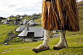 Slovenia, above Kamnik valley the Velika Planina plateau with traditional shepherd house made of wood,shepherds dressed in the traditional way, Samo is also studying mathematics../ Slovenie, au dessus de la vallee de Kamnik, le plateau de Velika Planina e