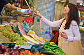 35 year old woman buying fruit. Shopping at the Bretxa Market. Donostia. San Sebastian. Gipuzkoa. Basque Country. Spain.