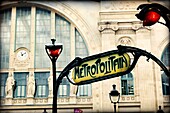 Partial view of the main facade of the Gare du nord and Art Deco entrance of the Metropolitan, Paris, France, Europe
