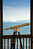 A telescope helps guests look at the Pacific Ocean from the Vanderslip Suite at the Terranea Resort in Palos Verdes, Catolina Island in the background..