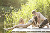 Young couple kissing at riverside