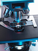 A light microscope examining a sample of tissue in lab for pharmaceutical research