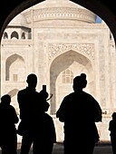 Silhouette of tourists at Taj Mahal in Agra, Uttar Pradesh, India.