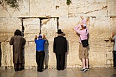 Jewish people praying at the wailing wall known also as the western wall , Jerusalem, Israel.