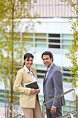 Businesswoman and businessman talking on stairs. business center. San Sebastian Technology Park. Donostia. Gipuzkoa. Basque Country. Spain.