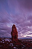 Timed Exposure Of Sunset Clouds Over Pinnacle In Arches National Park, Utah.