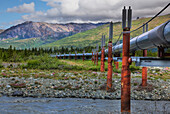 View Of The Alyeska Pipeline Crossing A River Along The Richardson Highway North Of Paxson, Southcentral Alaska, Summer, Hdr