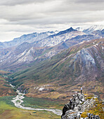 Hiker On Ridge Above Noatak River In Brooks Range, Gates Of The Arctic National Park, Northwestern Alaska, Above The Arctic Circle, Arctic Alaska, Summer.