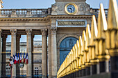 Gilded fence and the clock of the national assembly, place du palais bourbon, 7th arrondissement, paris, france