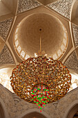 Glimmering chandelier in the big prayer hall of the sheikh zayed great mosque, abu dhabi, united arab emirates, middle east