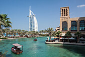 View of the hotel burj al arab from the hotel madinat jumeirah, dubai, united arab emirates, middle east