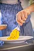 Chef Serving Taglierini Pasta, Close Up