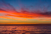 Sunrise off the coast of Akaroa, South Island, New Zealand, Pacific