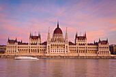 Hungarian Parliament Building and the River Danube at sunset, Budapest, Hungary, Europe
