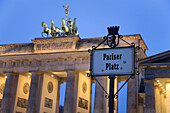Brandenburg Gate (Brandenburger Tor) and Quadriga winged victory and road sign Pariser Platz, Unter den Linden, Berlin, Germany, Europe