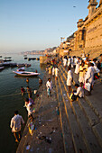 Crowd on the banks of the Ganges river at sunrise, Varanasi, India