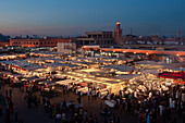 The evening market's stalls of Jemaa el-Fnaa selling foods after sunset, Marrakech, Morocco