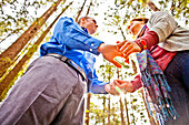 Hispanic couple holding hands in forest, Oakland, California, United States